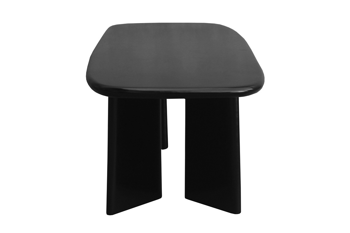 Rechteckiger Couchtisch aus massivem, schwarz gebeiztem Mangoholz, Seitenansicht, mit abgerundeten Kanten der Tischplatte.
