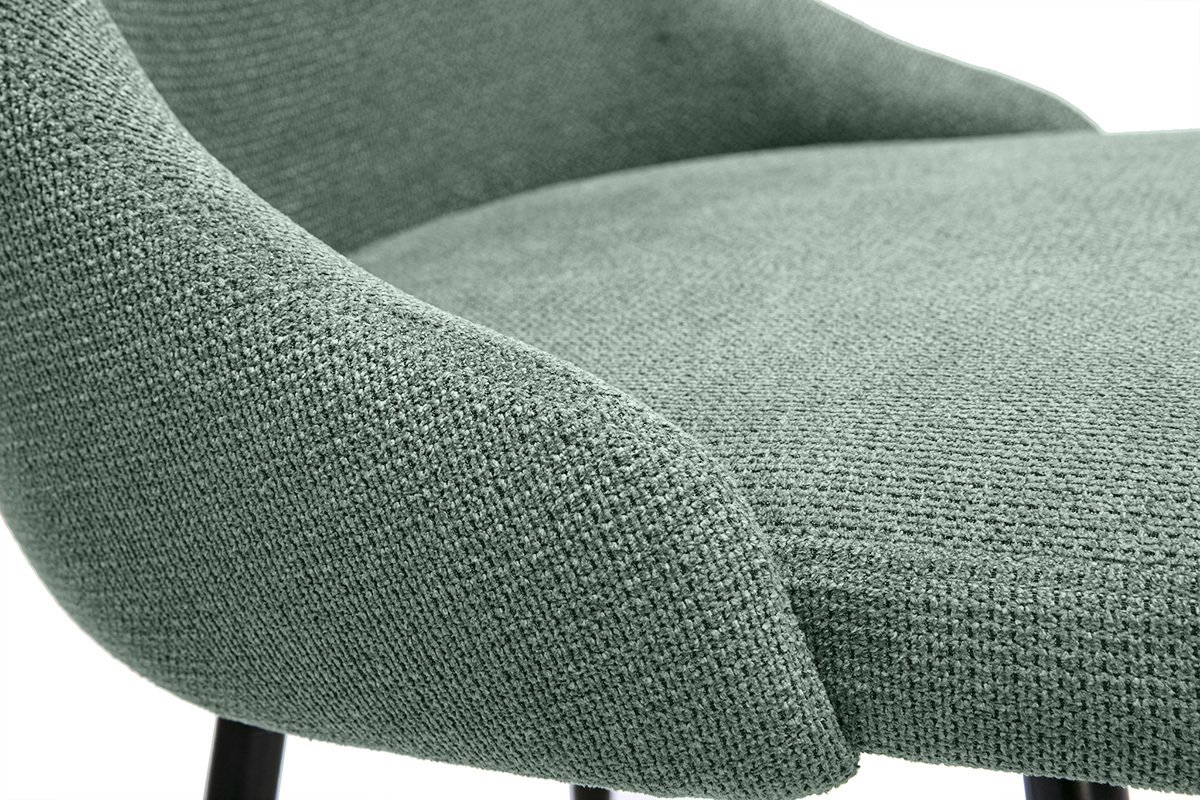 Detail eines Stuhls aus khakigr�nem Chenille-Stoff mit schwarzem Metallgestell, Nahaufnahme.