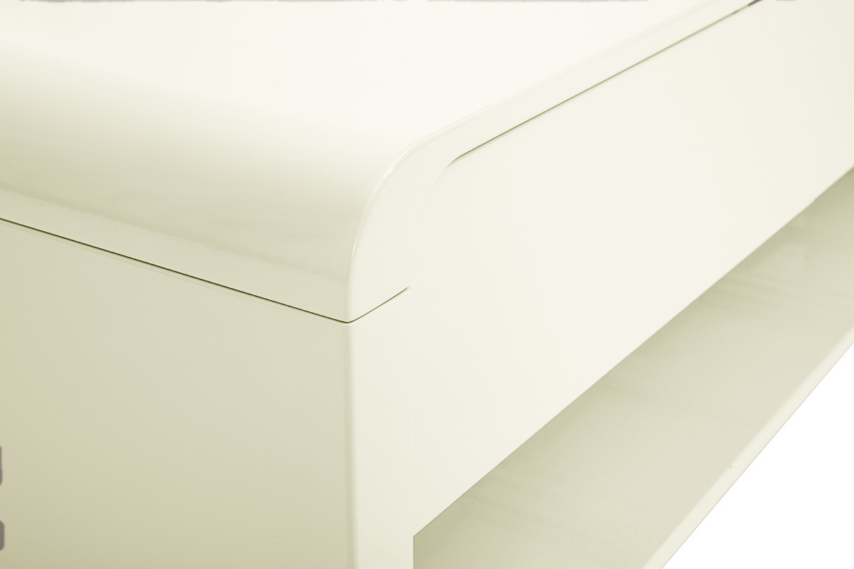 Ecke eines gl�nzenden beigen Fernsehm�bels mit sichtbarer Schublade.